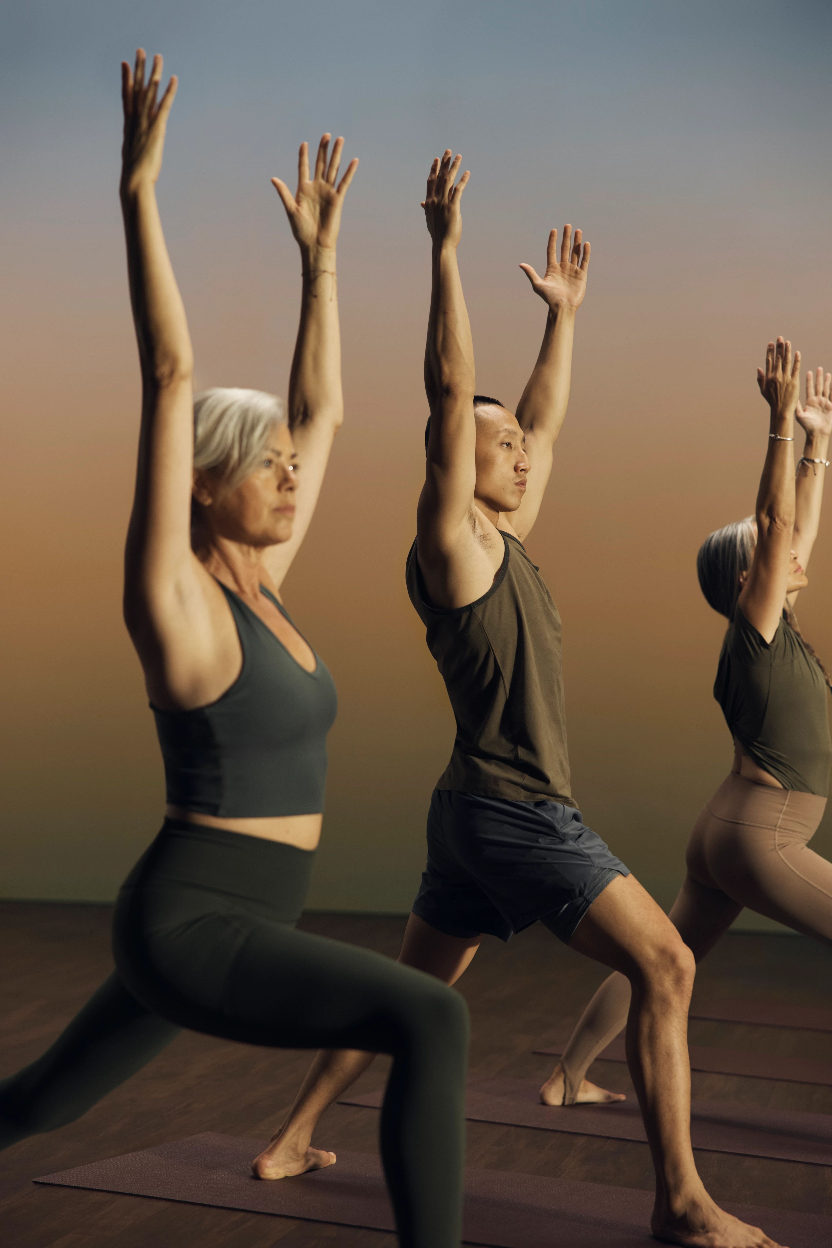 root-yoga-class-participants-in-warrior-pose-01